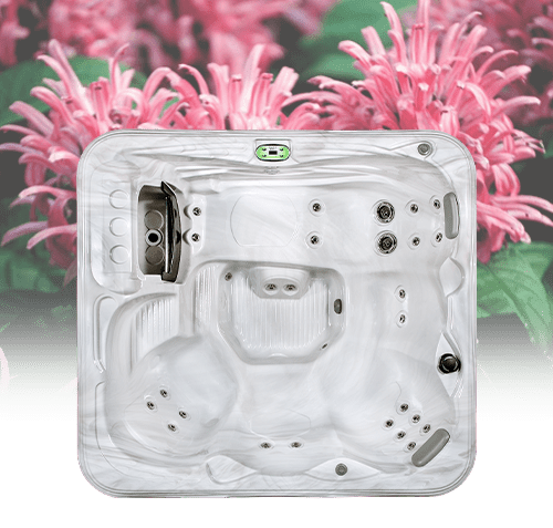 Spa tub surrounded by vibrant pink blooms